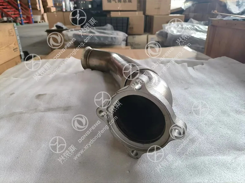 Close-up of quick-release circular clamp connector interface connecting exhaust flexible metal hose