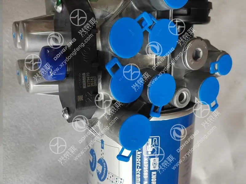 Side close view of multiple standard blue dust-proof capped air ports integrated air dryer assembly OE 3543010-92302 Dongfeng GX & KX heavy truck chassis