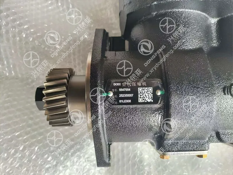 Close-up of alloy drive gear and OEM part QR code label air compressor C5547554 DCEC Cummins